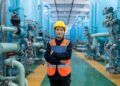 A water engineer inspects membrane filtration equipment at a Singapore water innovation facility