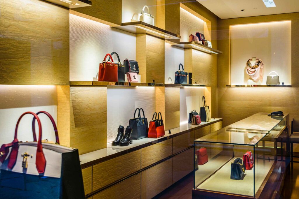 Luxury handbag display in an upscale boutique store interior Singapore mall