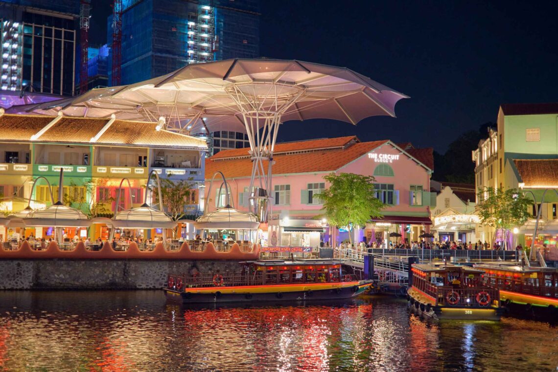 Waterfront restaurants with colourful lights reflected on the river at night Clarke Quay Singapore - SINwebzine Waterfront restaurants with colourful lights reflected on the river at night Clarke Quay Singapore