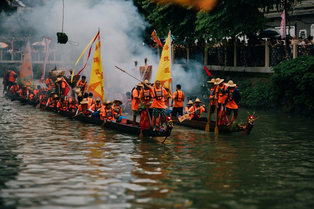 Spectators watching a dragon boat race at one of the most popular free June events in Singapore on the water