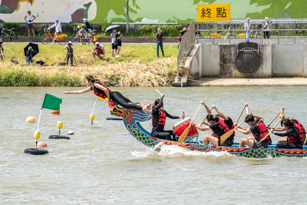 Dragon boat paddlers racing across Bedok Reservoir during the Dragon Boat Festival in Singapore