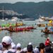 dragon-boat-racing-unsplash - SINwebzine A team of paddlers competing in June festivals Singapore dragon boat races at Bedok Reservoir, drums beating .