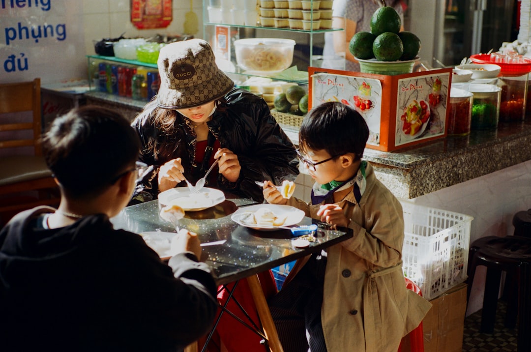 A family sharing zongzi at a Chinatown street stall during the Dragon Boat Festival in Singapore