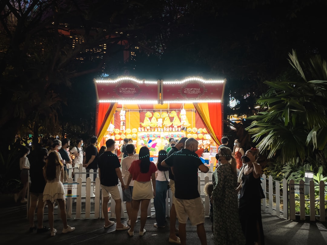 A family with young children enjoying free outdoor June events in Singapore at a festival play zone