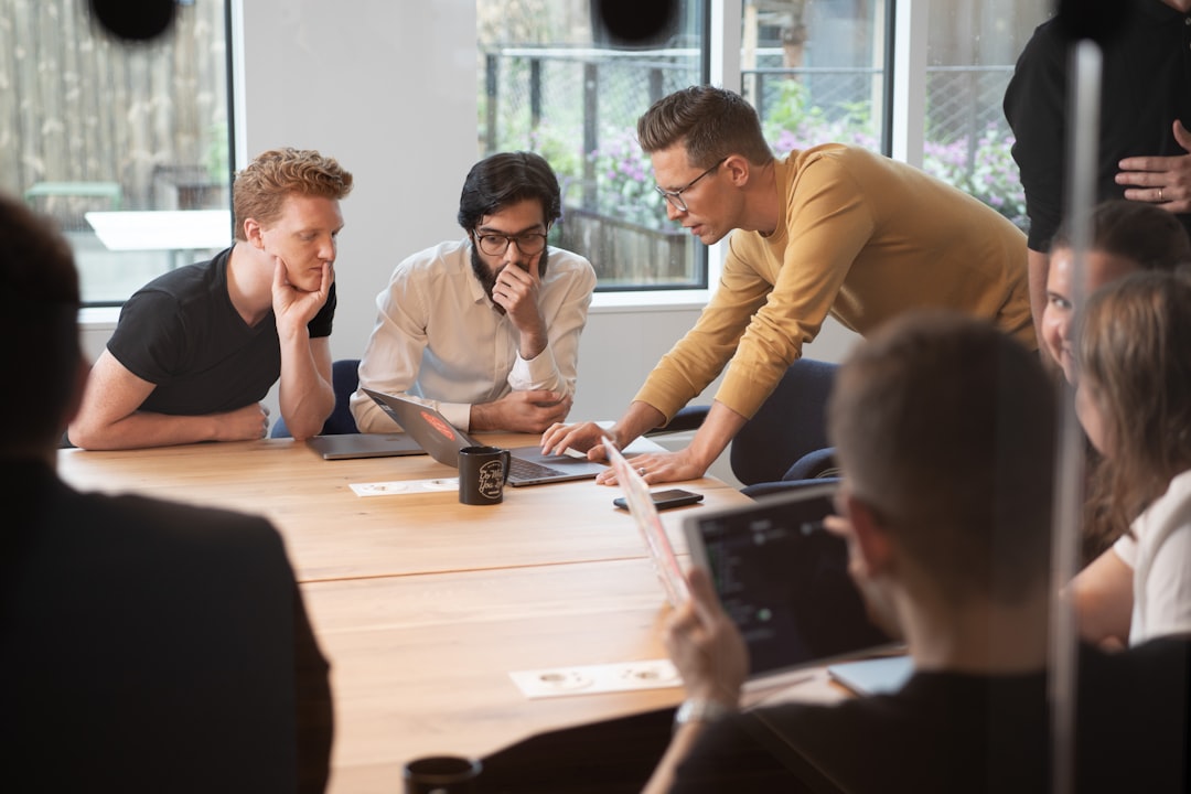 A team of diaspora entrepreneurs discusses strategy in a office, reflecting the transnational networks these founders create