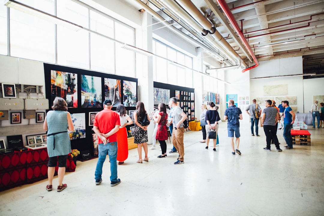 Visitors browse original artworks by participating illustrators at the illustration arts fest in Tanjong Pagar