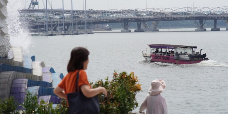 woman-boarding-ferry-singapore-unsplash - SINwebzine A traveller boards a ferry at Tanah Merah terminal, ready for one of the popular day trips from Singapore to Bintan Island.
