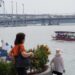 woman-boarding-ferry-singapore-unsplash - SINwebzine A traveller boards a ferry at Tanah Merah terminal, ready for one of the popular day trips from Singapore to Bintan Island.