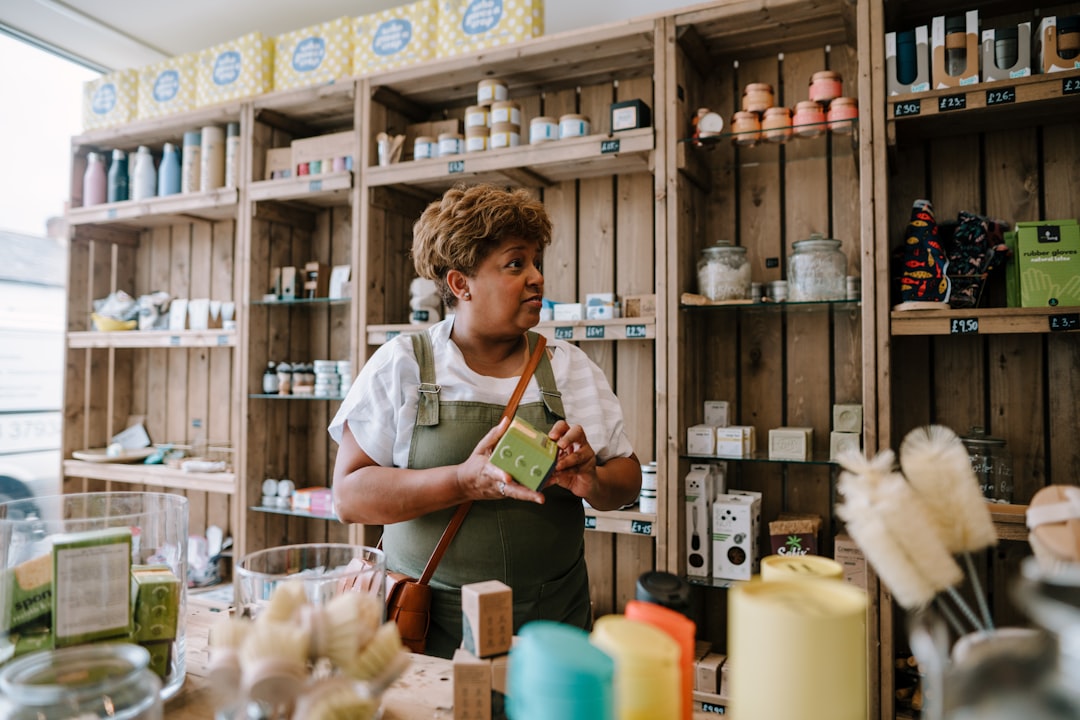 A woman examining natural botanical ingredients used by Singapore beauty brands for clean skincare formulas
