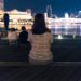 strolling the Marina Bay waterfront during June events in Singapore, surrounded by glowing light installations at night