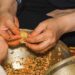 woman-wrapping-rice-dumpling-unsplash - SINwebzine A woman carefully wrapping zongzi rice dumplings at a Dragon Boat Festival workshop in Singapore