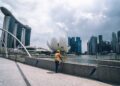 architect-reviewing-building-blueprints-singapore-unsplash - SINwebzine A Singapore architect reviews building plans designed to address the urban heat island effect in the Central District