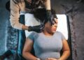 dermatologist-examining-patient-skin-unsplash - SINwebzine A board-certified dermatologist examines a patient's skin during a Singapore dermatology consultation in a clinical setting