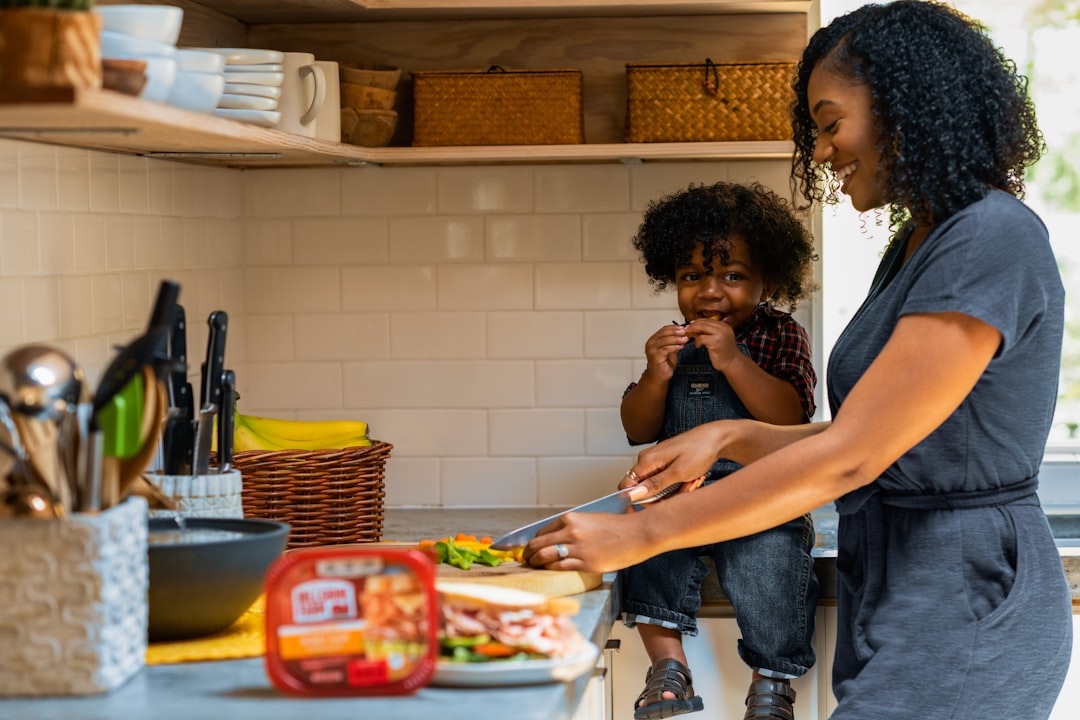 A Singaporean expat family prepares traditional dishes in a shared urban kitchen, keeping diaspora food