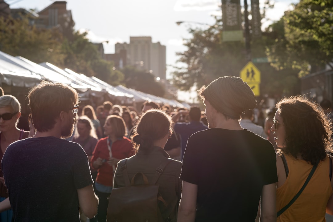 Members of a Singaporean expat community gather at a colourful neighbourhood street festival, celebrating cultural identity