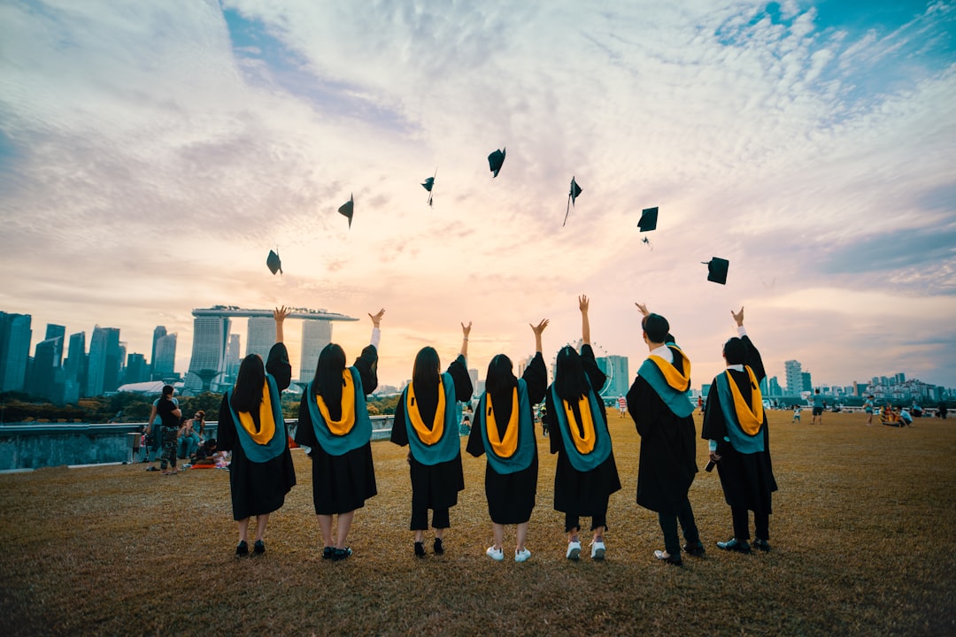 Graduates networking at a Singapore financial district event, where bilingual education gives professionals a salary
