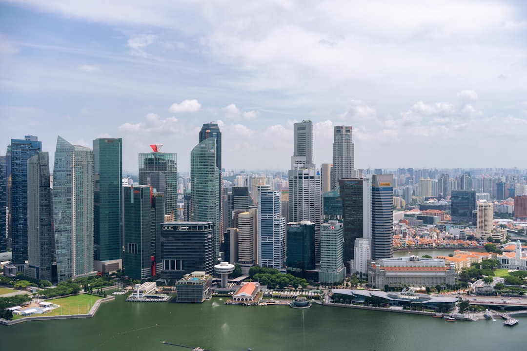A business professional overlooking Marina Bay Sands as Singapore tourist arrivals reshape the retail landscape