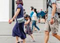 Tourists and shoppers walking along Orchard Road in Singapore as tourist arrivals reach a record high in July 2026