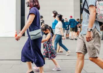 Tourists and shoppers walking along Orchard Road in Singapore as tourist arrivals reach a record high in July 2026