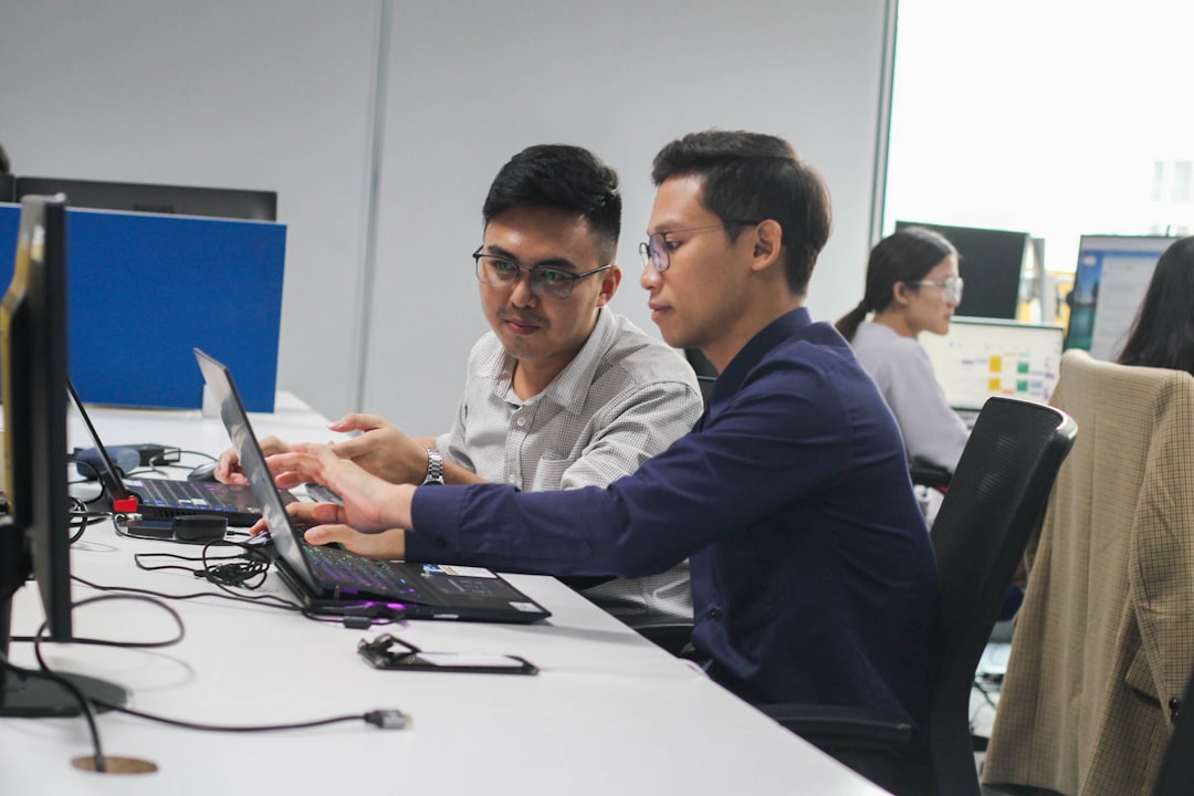 Finance professionals in Singapore analyse hiring surge vacancy data at a business meeting