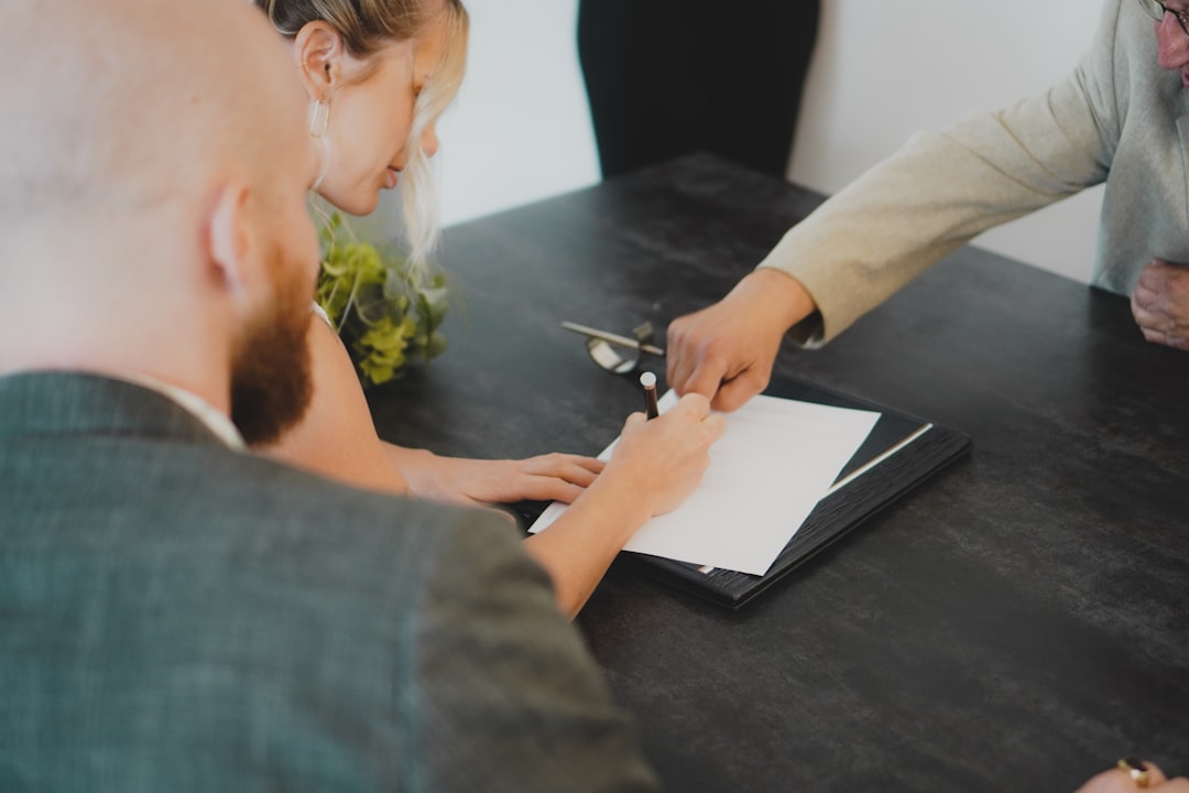 A professional signs a nominee director agreement as part of the Singapore company registration process