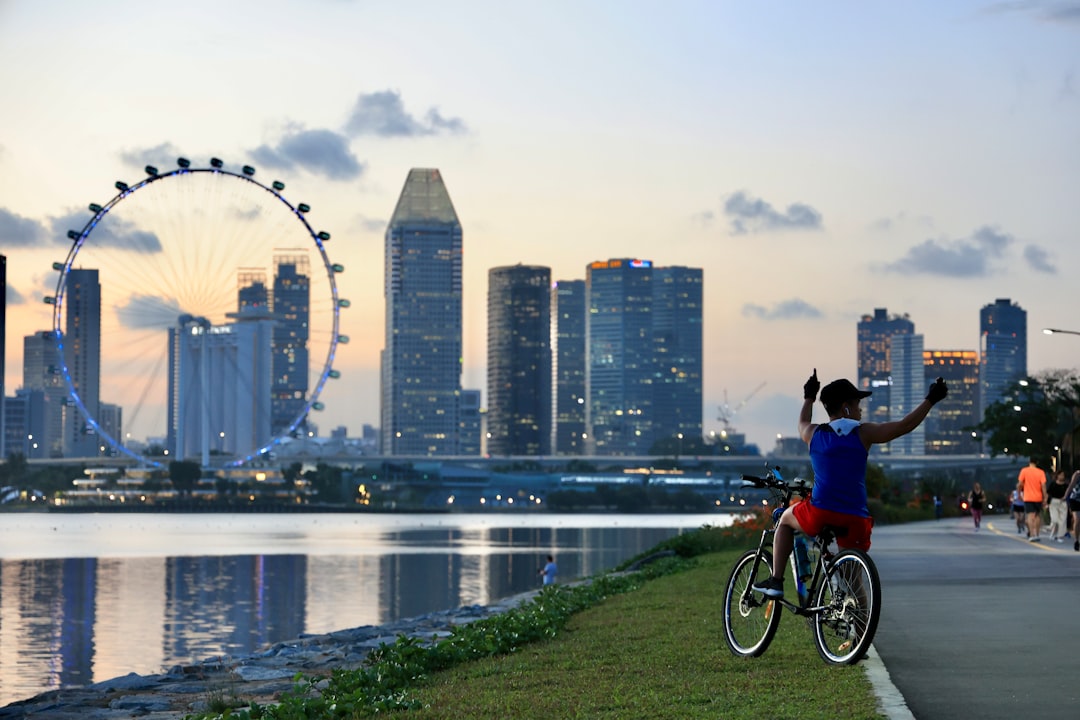 Children compete in badminton at a community festival connected to Singapore's youth Olympic legacy initiative.