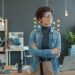 foreign-entrepreneur-standing-in-office-unsplash - SINwebzine A foreign founder reviews documents at a desk while setting up a Singapore company remotely