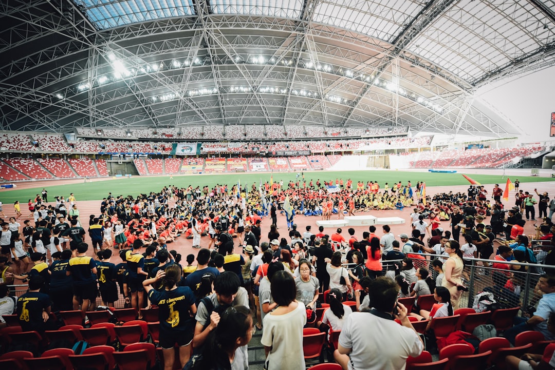 Youth volunteers manage a sport event in Singapore, continuing the community spirit of the youth Olympic legacy programme.