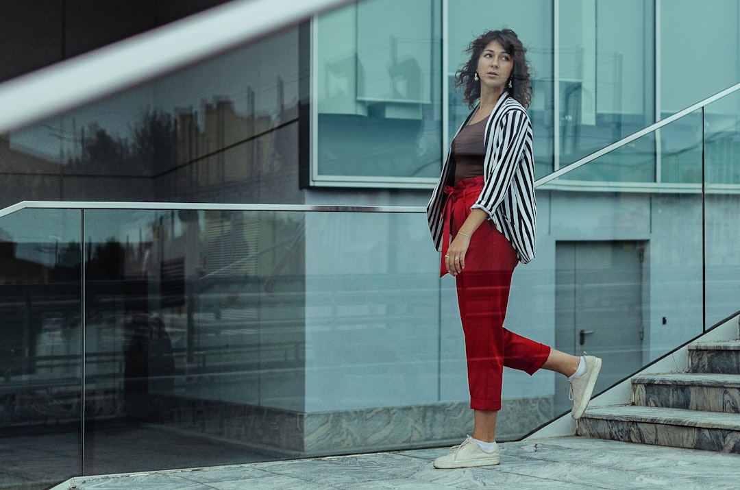 A woman in a red and white look assembled entirely as a secondhand outfit for Singapore National Day celebrations