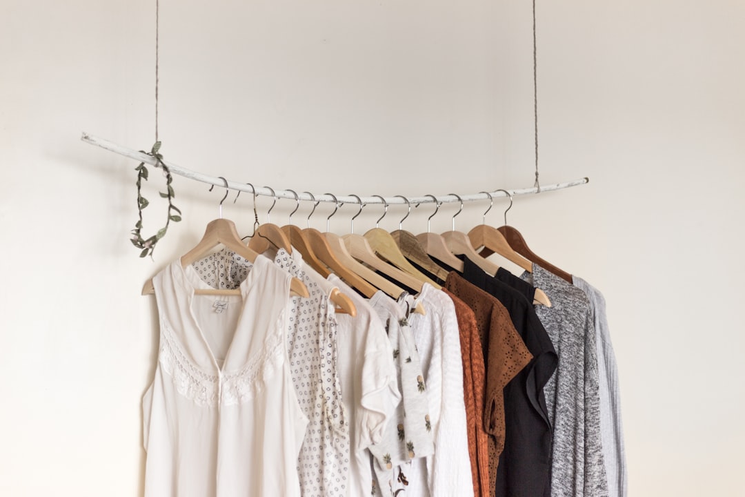 A woman's neutral clothing pieces that form a capsule wardrobe designed for Singapore's unpredictable August weather.