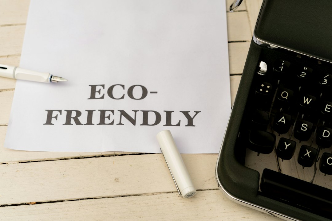 A sustainability professional studies a printed report beside a laptop, exploring how a carbon credit exchange