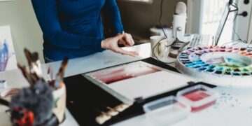 A beginner carving a linoleum block at one of Singapore's printmaking studios during a hands-on workshop session
