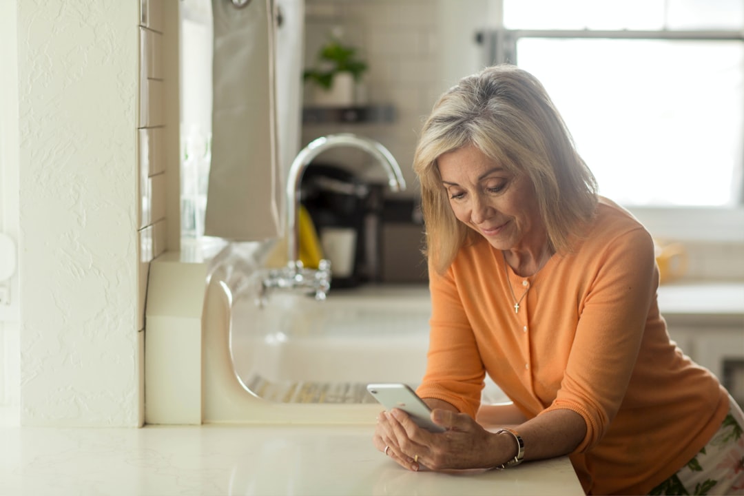 A woman reviewing her electricity bill after benefiting from rooftop solar export credits under Singapore's incentive schemes