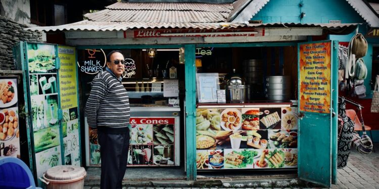 Hygiene grades what they mean before you eat photo 1 - SINwebzine Hawker stall owner displaying hygiene grades decal at counter