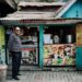 Hygiene grades what they mean before you eat photo 1 - SINwebzine Hawker stall owner displaying hygiene grades decal at counter