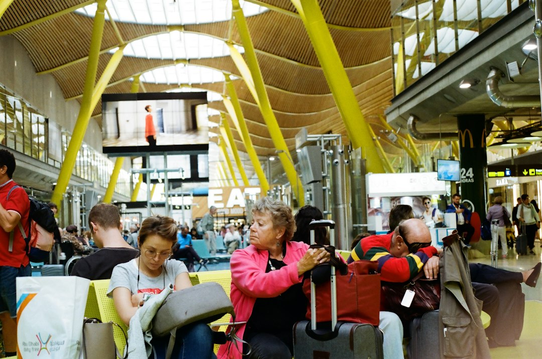 Family with suitcases heading to board year-end flights from Singapore