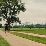 Runner doing marathon training at dawn in Singapore's East Coast Park